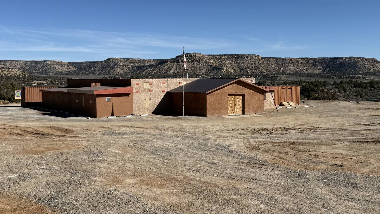 The Cockhouse lodge compound with the mesa behind, Blanco New Mexico