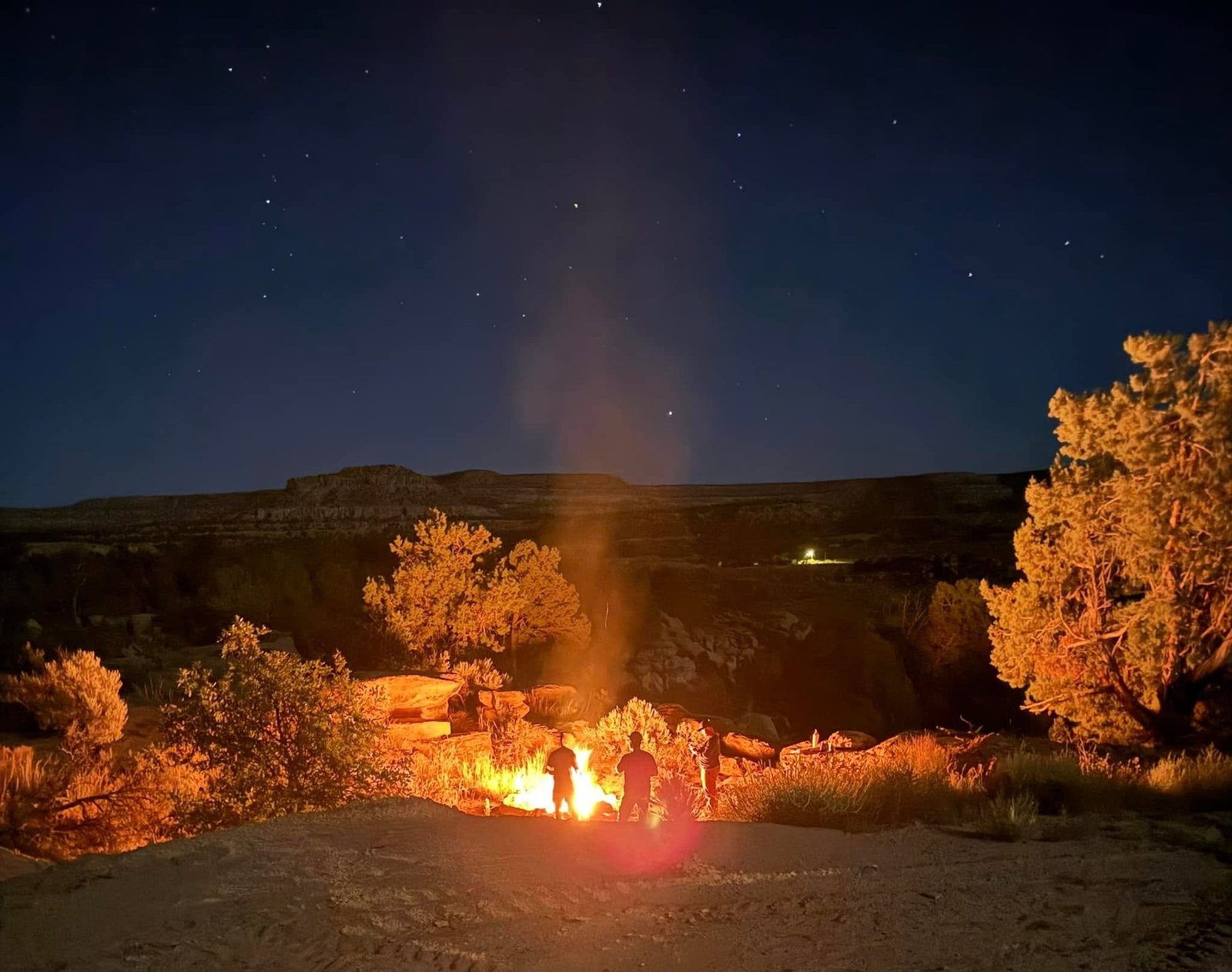 Campfire under the stars above the mesa near The Cockhouse