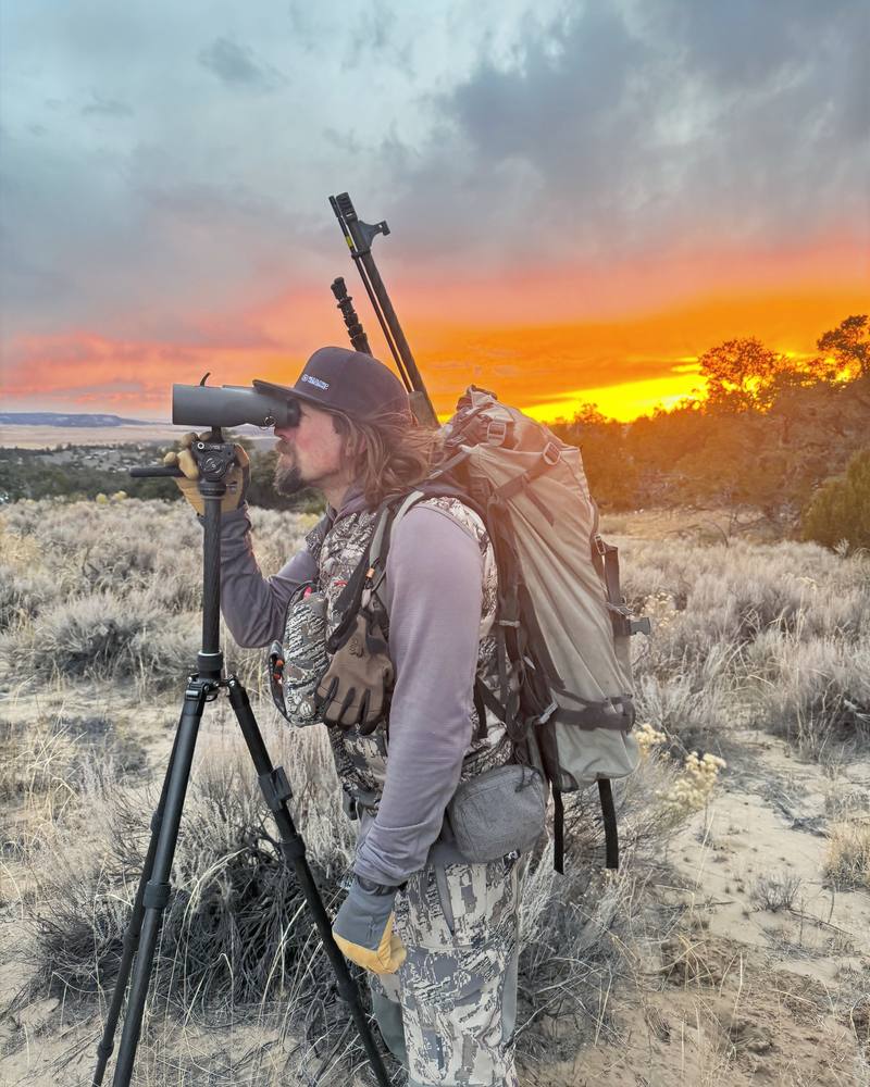 Wild Out Pro guide glassing at sunrise in New Mexico